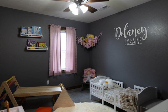 bedroom with carpet, ceiling fan, and multiple windows