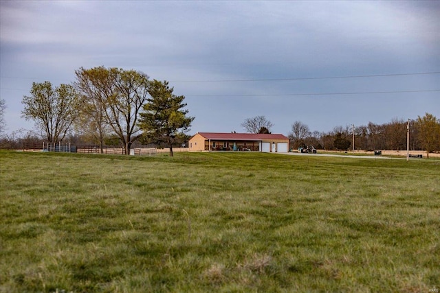 view of yard with a rural view