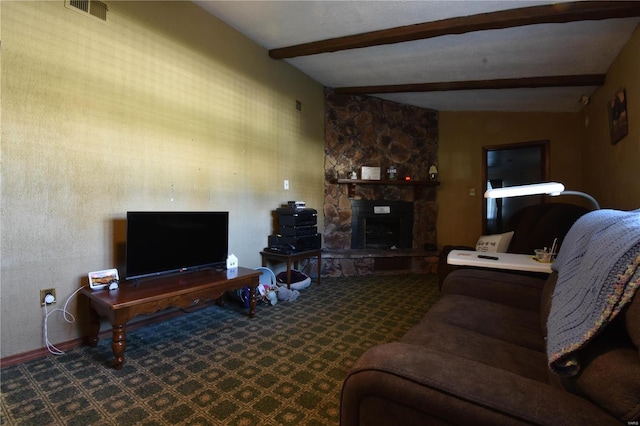 living room featuring lofted ceiling with beams, dark carpet, and a stone fireplace