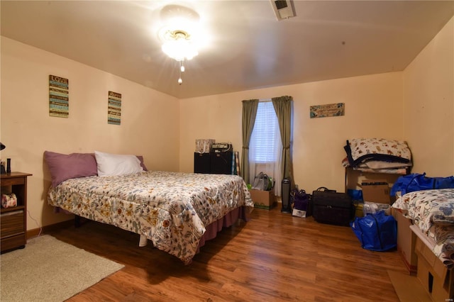 bedroom featuring dark hardwood / wood-style floors