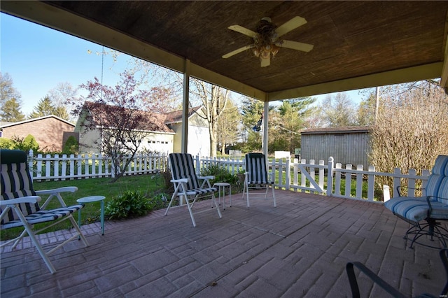 wooden deck featuring a patio area and ceiling fan