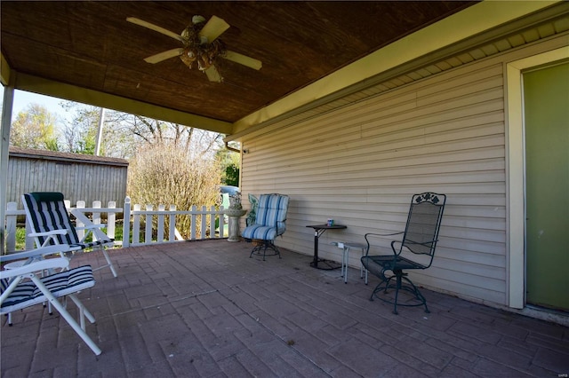 exterior space featuring ceiling fan