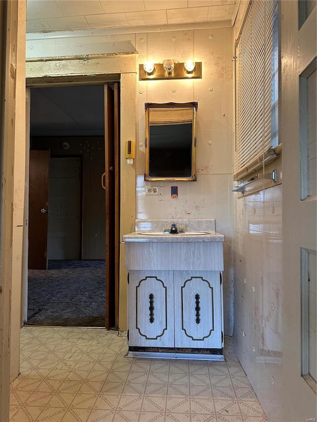 bathroom with oversized vanity and tile flooring