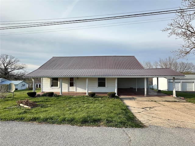 farmhouse inspired home with a carport and a front yard