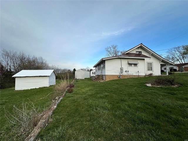 view of home's exterior with a lawn