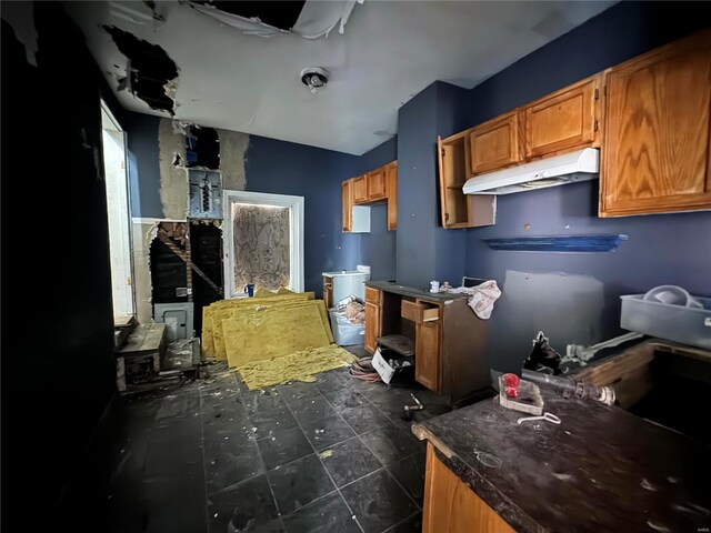 kitchen with dark tile flooring