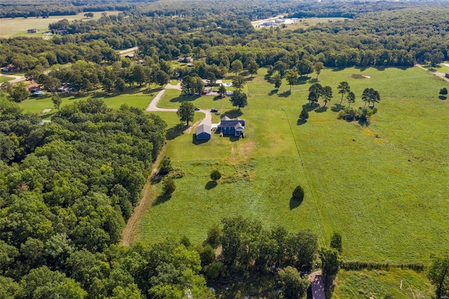 birds eye view of property with a rural view