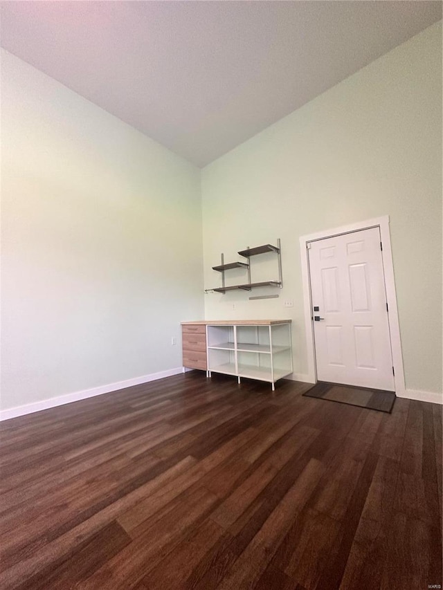 empty room featuring dark hardwood / wood-style flooring