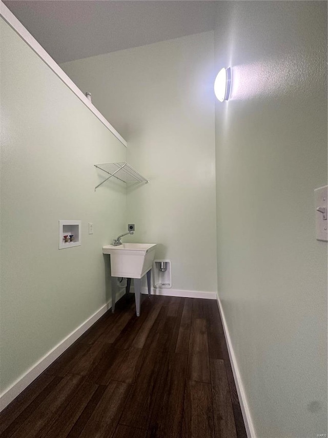 laundry room featuring washer hookup and dark wood-type flooring