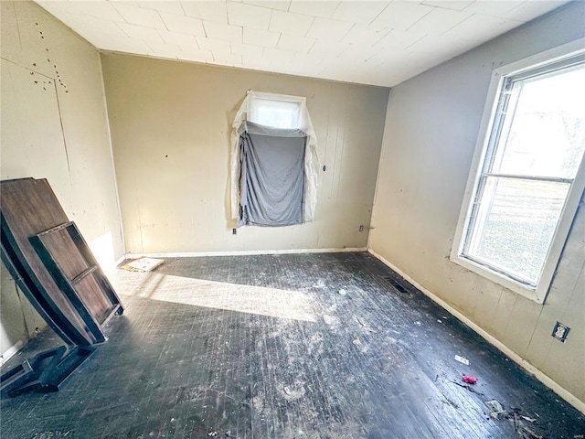 spare room with hardwood / wood-style flooring