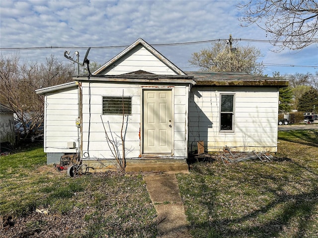 view of outbuilding with a lawn