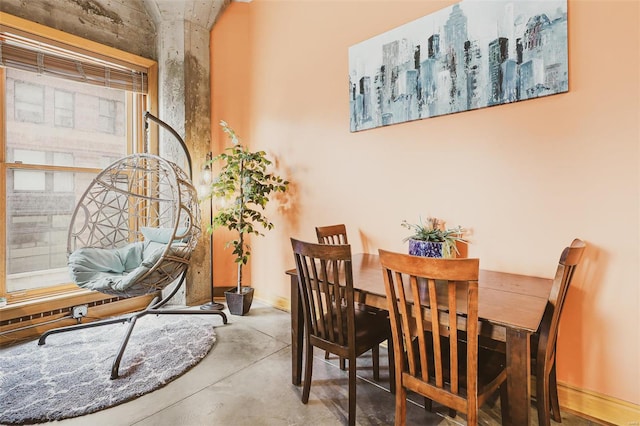 dining room featuring concrete flooring