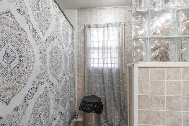 bathroom with tile walls