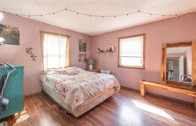 bedroom featuring dark hardwood / wood-style floors