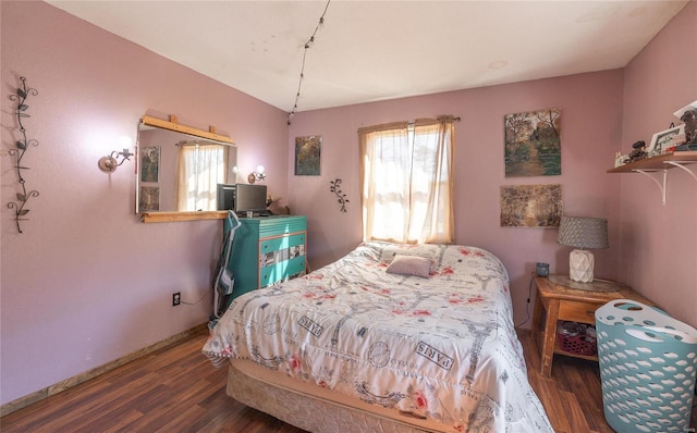 bedroom featuring dark wood-type flooring