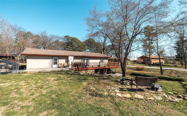 view of yard with a wooden deck