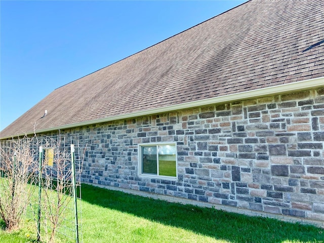 view of side of home featuring a yard