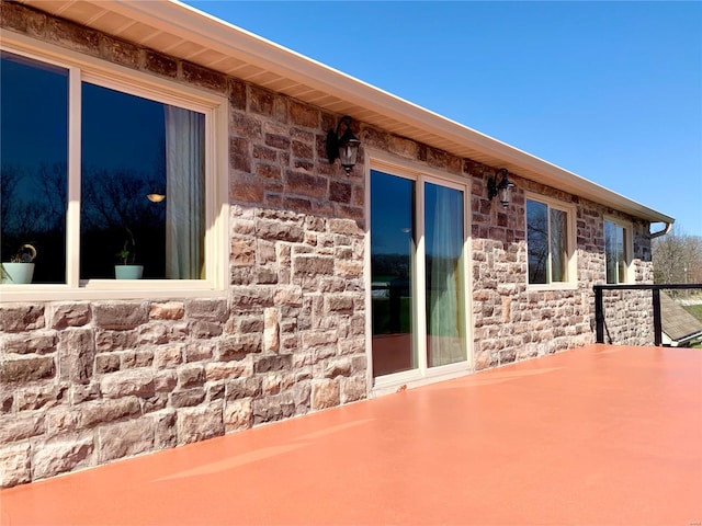 view of side of home with a patio