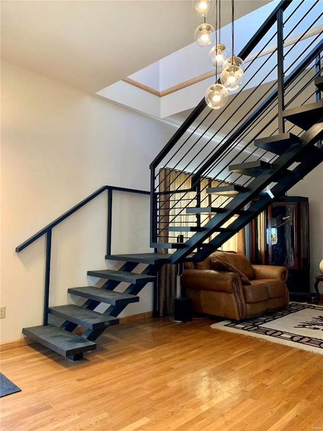 staircase featuring light hardwood / wood-style floors