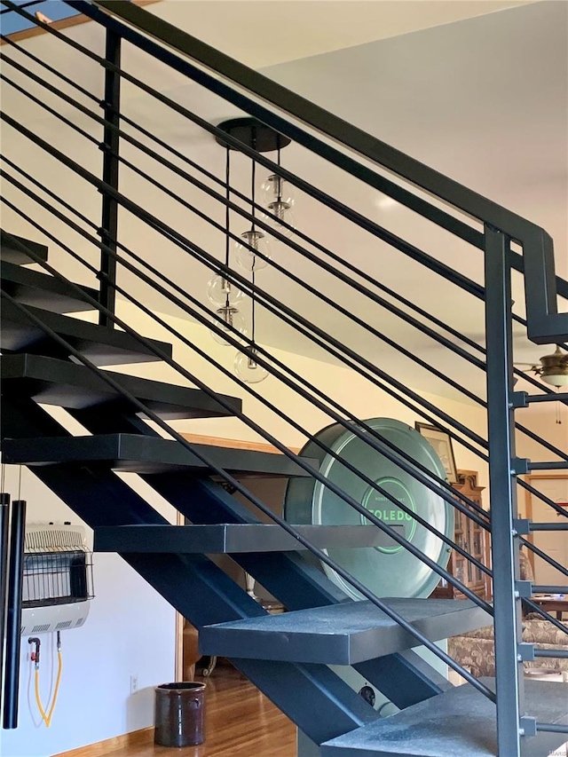 stairway with hardwood / wood-style flooring