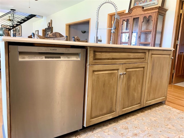 kitchen featuring dishwasher and light wood-type flooring