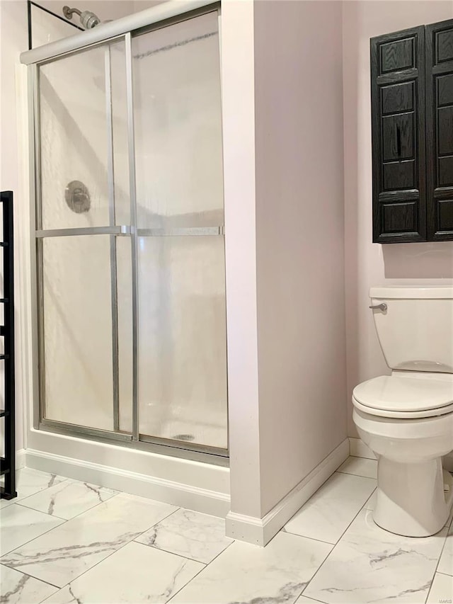 bathroom with toilet and tile flooring