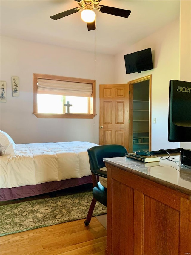 bedroom featuring wood-type flooring and ceiling fan