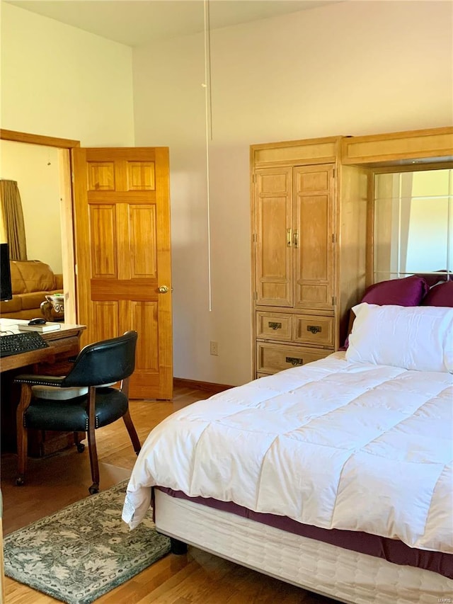 bedroom featuring light wood-type flooring