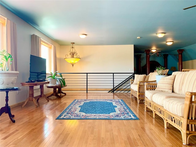 sitting room featuring wood-type flooring