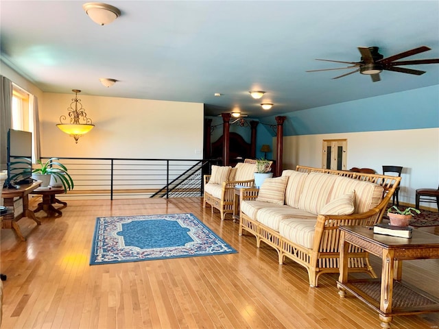 living room featuring ceiling fan and light wood-type flooring