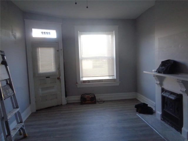 unfurnished living room featuring dark hardwood / wood-style floors