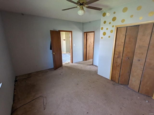 unfurnished bedroom with a closet, light carpet, and ceiling fan