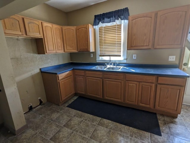 kitchen with dark tile floors and sink