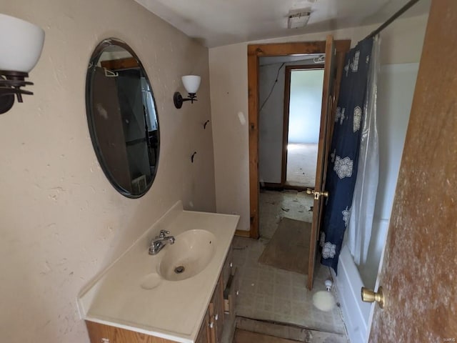 bathroom with vanity with extensive cabinet space and tile flooring