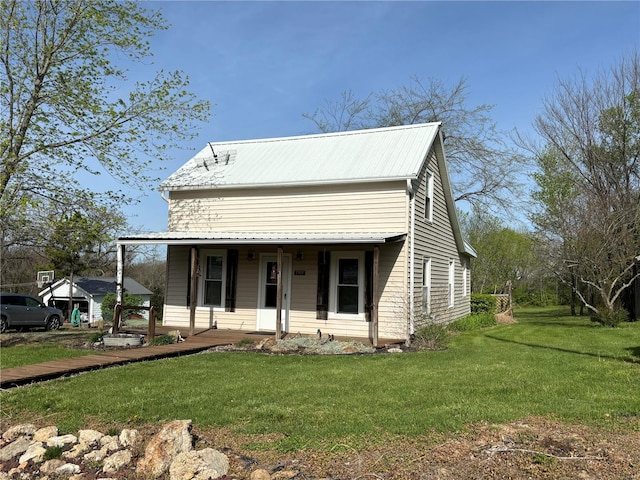 view of front of house featuring a front yard and a porch