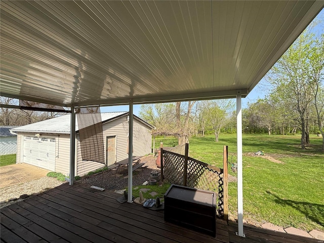 wooden deck featuring a yard and a garage