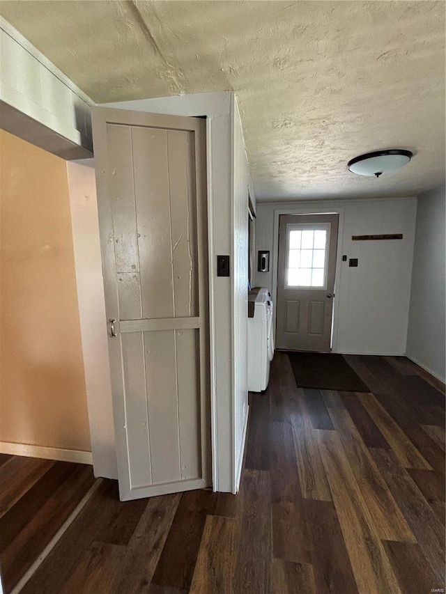 entryway featuring a textured ceiling and dark hardwood / wood-style floors