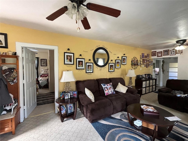 living room featuring ceiling fan and light carpet