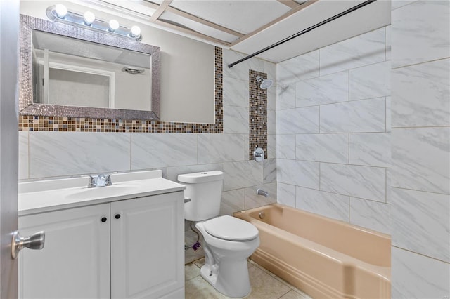 full bathroom with tiled shower / bath combo, toilet, tile flooring, vanity, and tile walls