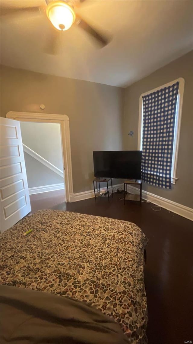 bedroom with hardwood / wood-style flooring and ceiling fan