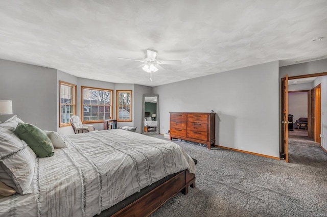 bedroom featuring dark carpet and ceiling fan