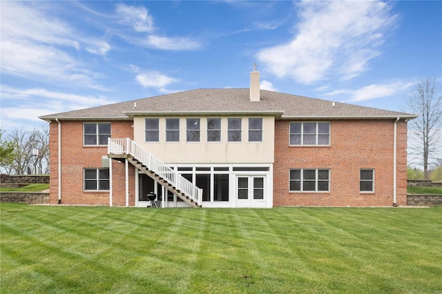 rear view of property with a yard