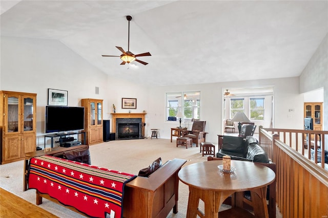 living room featuring ceiling fan, light carpet, and high vaulted ceiling