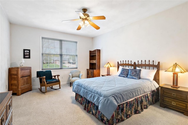 bedroom featuring ceiling fan and light colored carpet