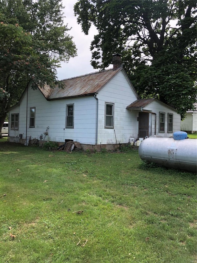 view of home's exterior featuring a yard