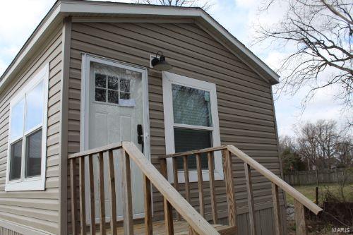 view of property exterior featuring a deck