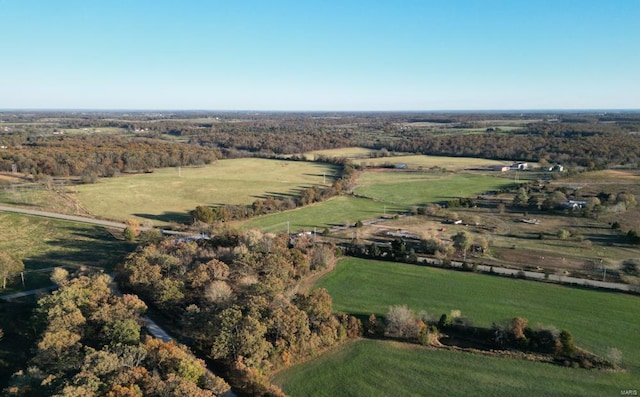 birds eye view of property with a rural view