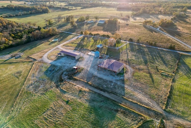 birds eye view of property with a rural view