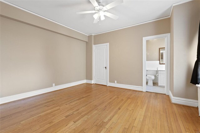 empty room featuring light hardwood / wood-style flooring, ornamental molding, and ceiling fan