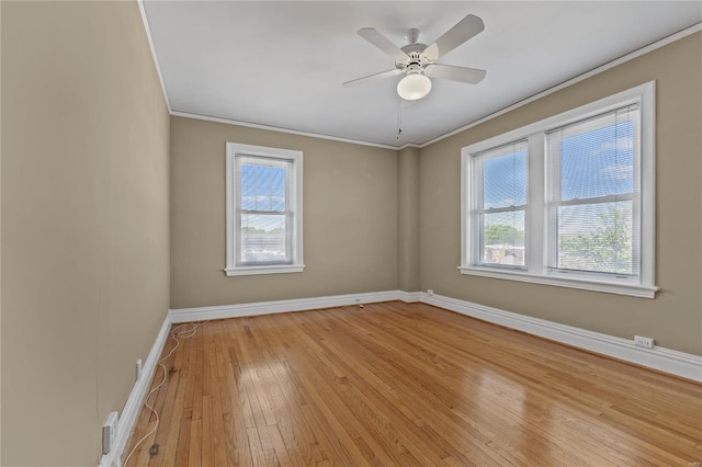 unfurnished room with ceiling fan, ornamental molding, and light hardwood / wood-style flooring